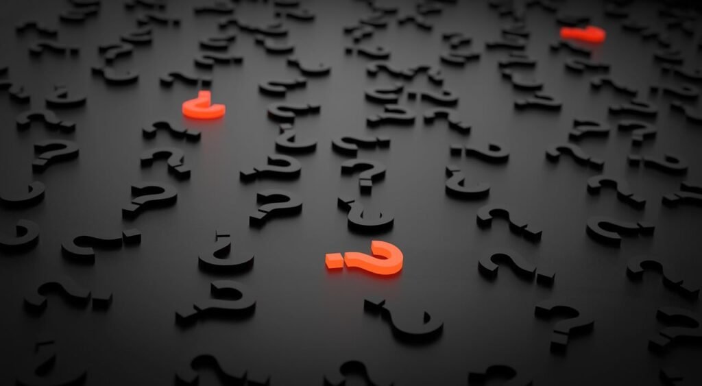 Red question marks among black ones