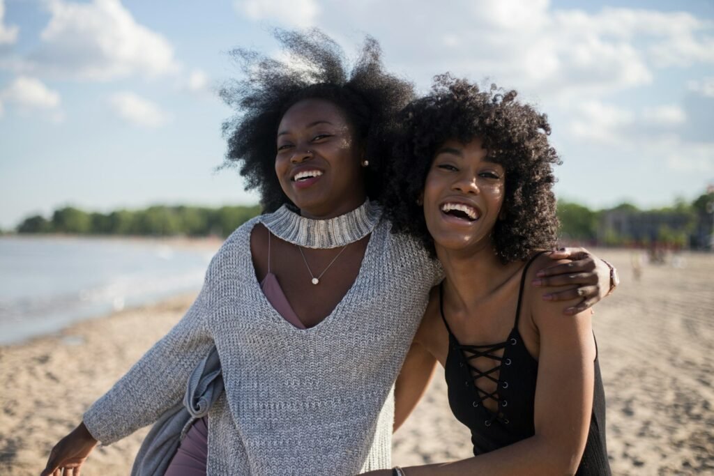 African American women at seashore.