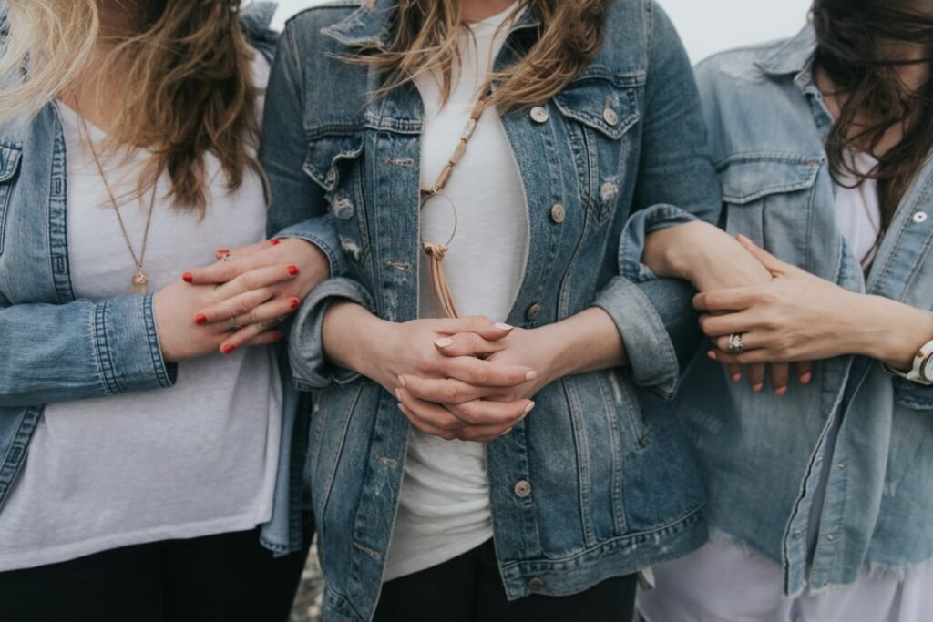Women with clasped hands.