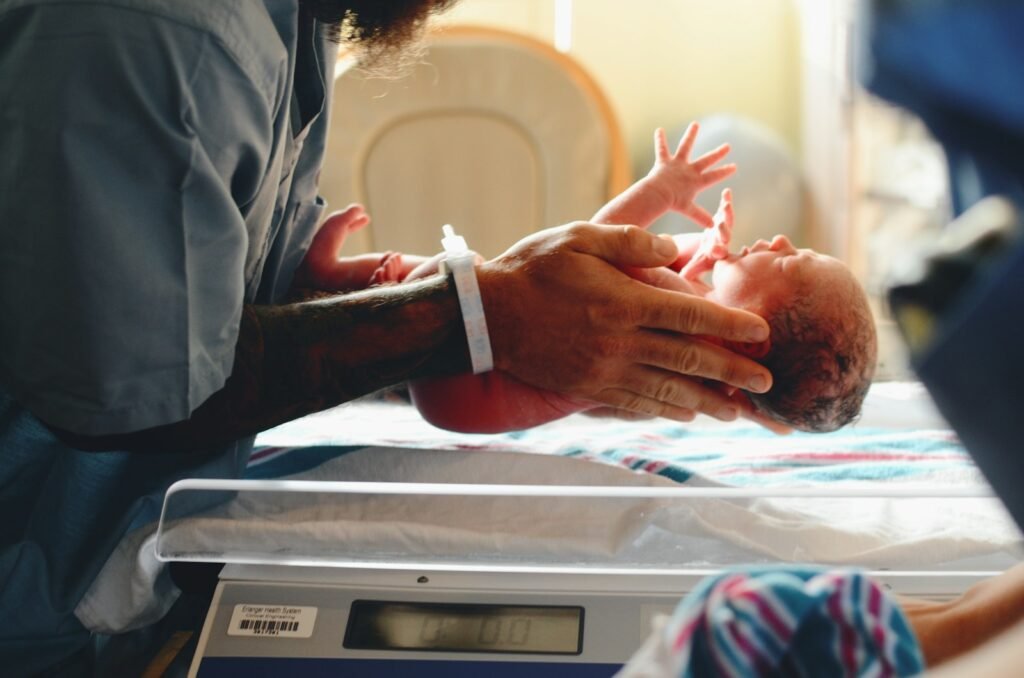 Newborn baby being weighed
