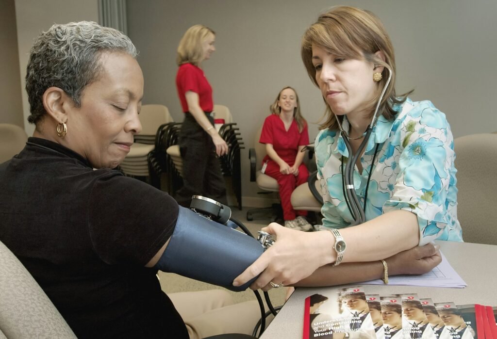 Woman getting her blood pressure checked.