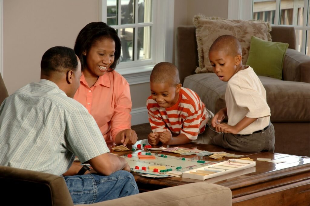 African American family playing board games.
