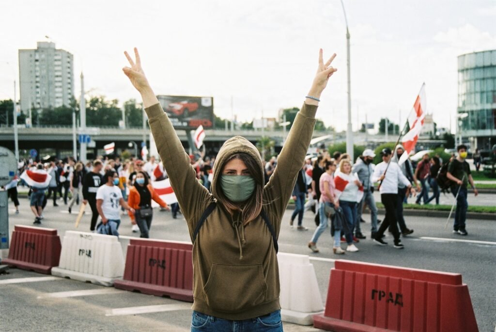 Woman raising her hands during a protest.