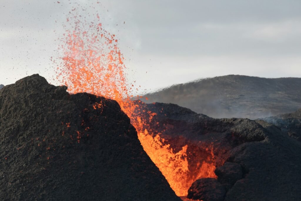 Lava on brown rocky mountain.