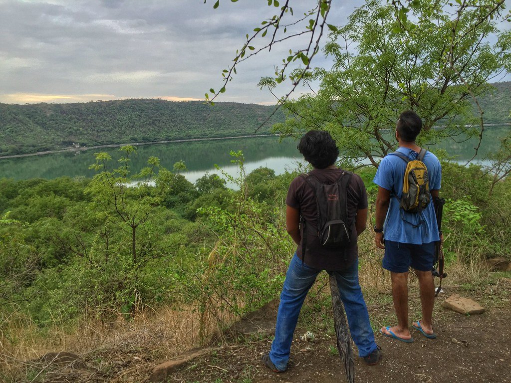 Tourists enjoying the view of Lonar Lake.