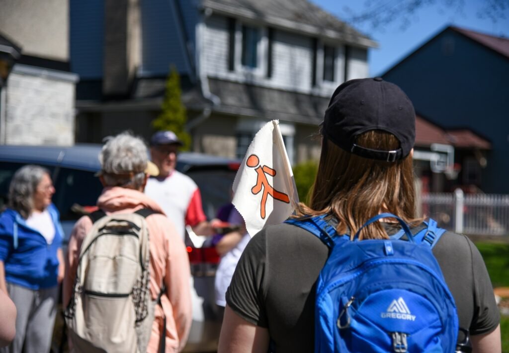 A group of people walking down a street.
