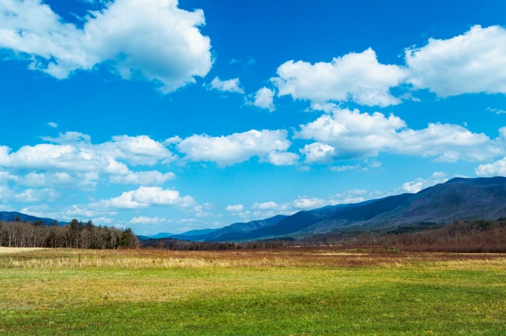 Green field on the Appalachian mountains in the background.