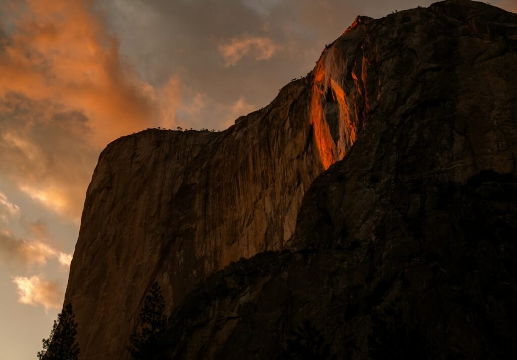 Brown rock formation with firefall.