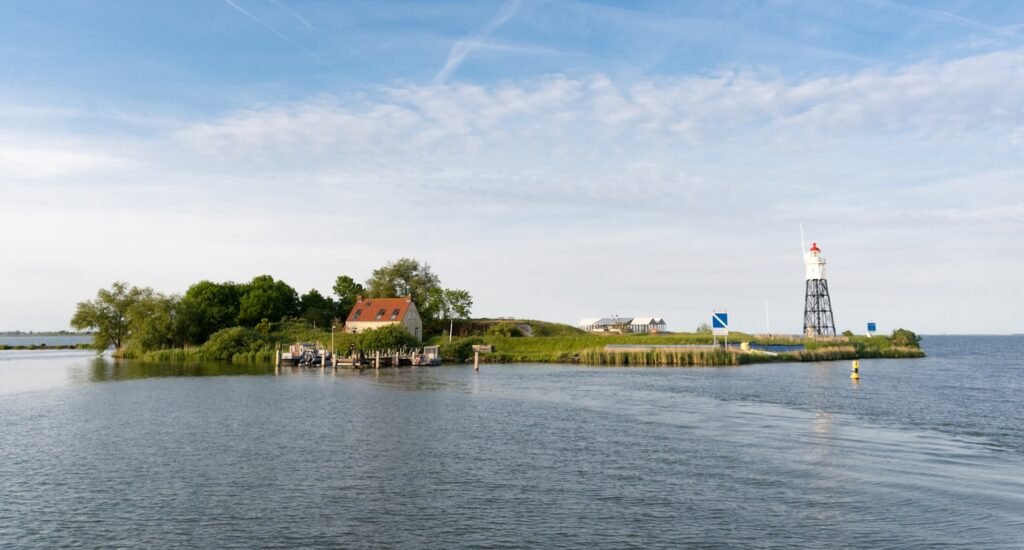 Small island in the middle of a body of water.