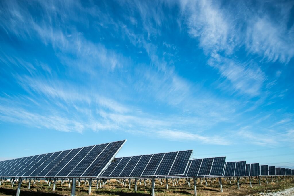 Solar panels under blue sky.