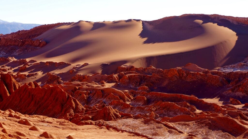 Atacama Desert's rock formation under white sky.