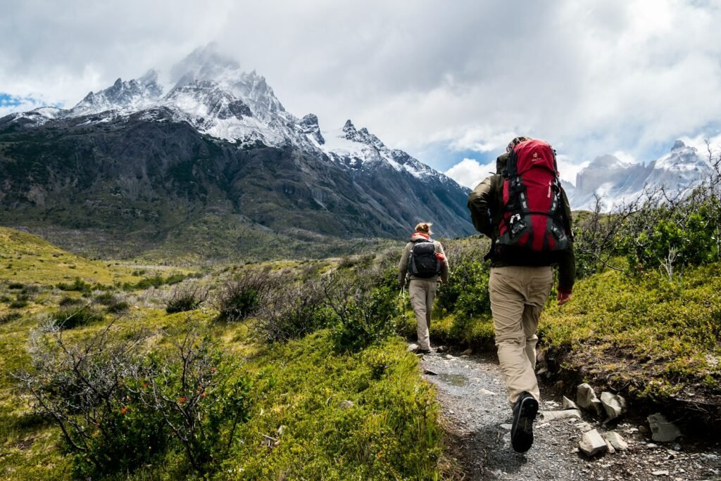 Person walking towards mountain.