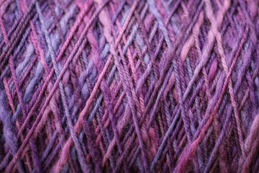 a close up of a purple and purple yarn
