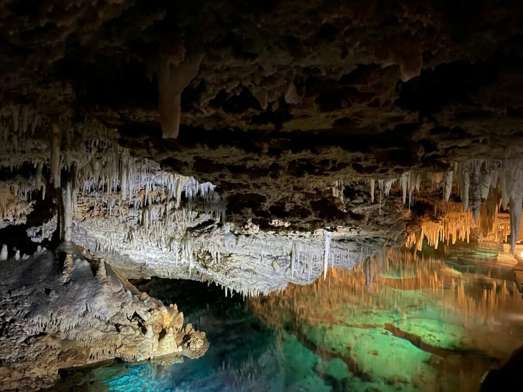 Explore the mesmerizing stalactites and reflections in Bermuda's Crystal Cave.