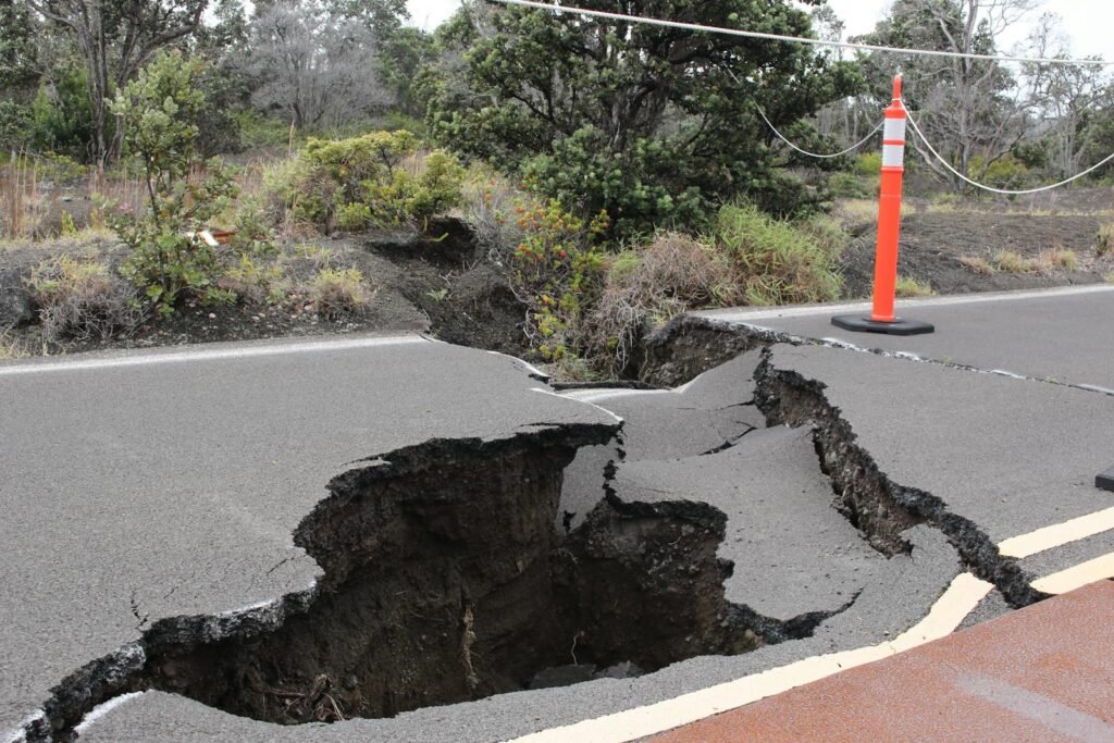 Severe road damage with large cracks in Volcano, Hawaii caused by an earthquake.