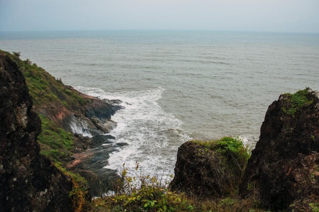 Breathtaking view of a rocky coastline, showcasing cliffs and ocean waves.