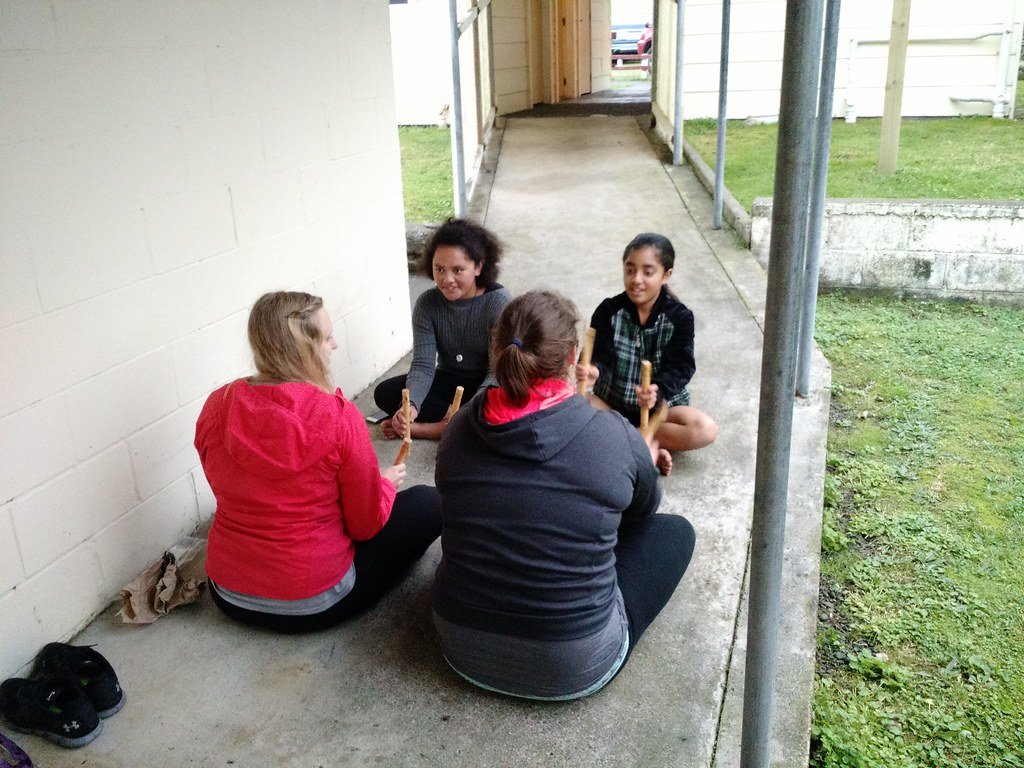 Maori children playing with other kids.