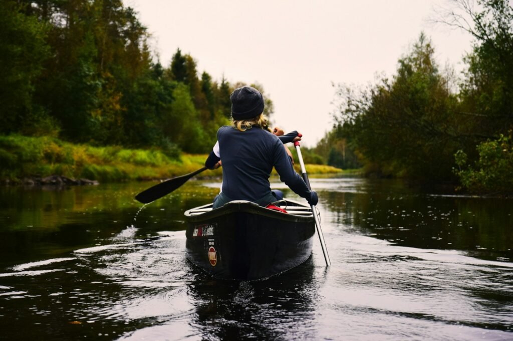 person sitting on kayak