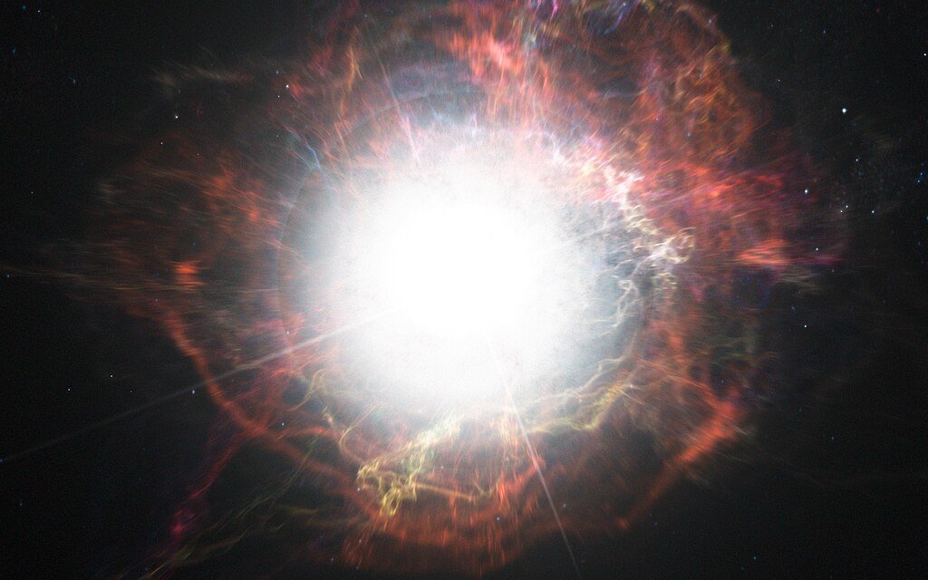 This artist’s impression shows dust forming in the environment around a supernova explosion. VLT observations have shown that these cosmic dust factories make their grains in a two-stage process, starting soon after the explosion, but continuing long afterwards.