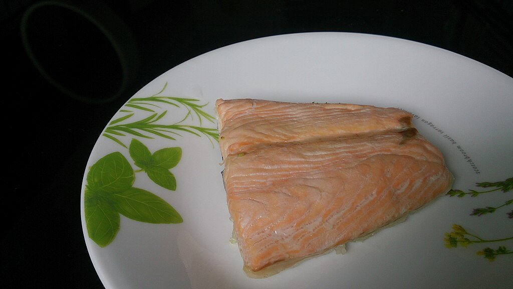 A salmon in a white plate