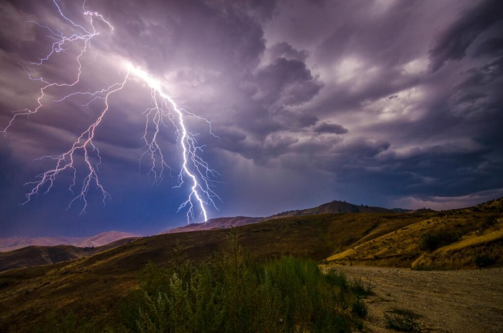 A breathtaking lightning strike during a thunderstorm over the Wenatchee hills, capturing the power of nature.