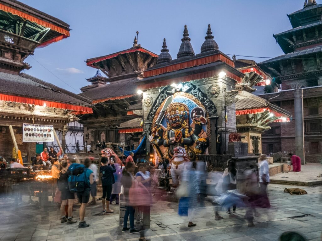 Crowd standing in front of a temple in Kathmandu.