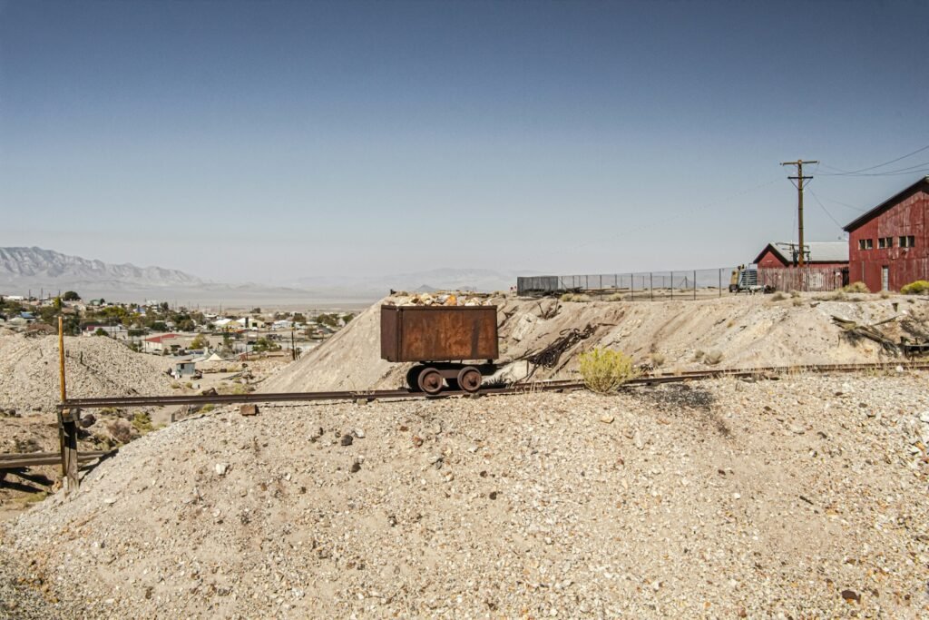 brown and white truck on gray sand during daytime