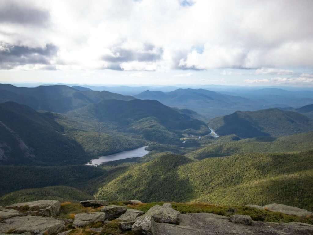 green mountains under white clouds during daytime