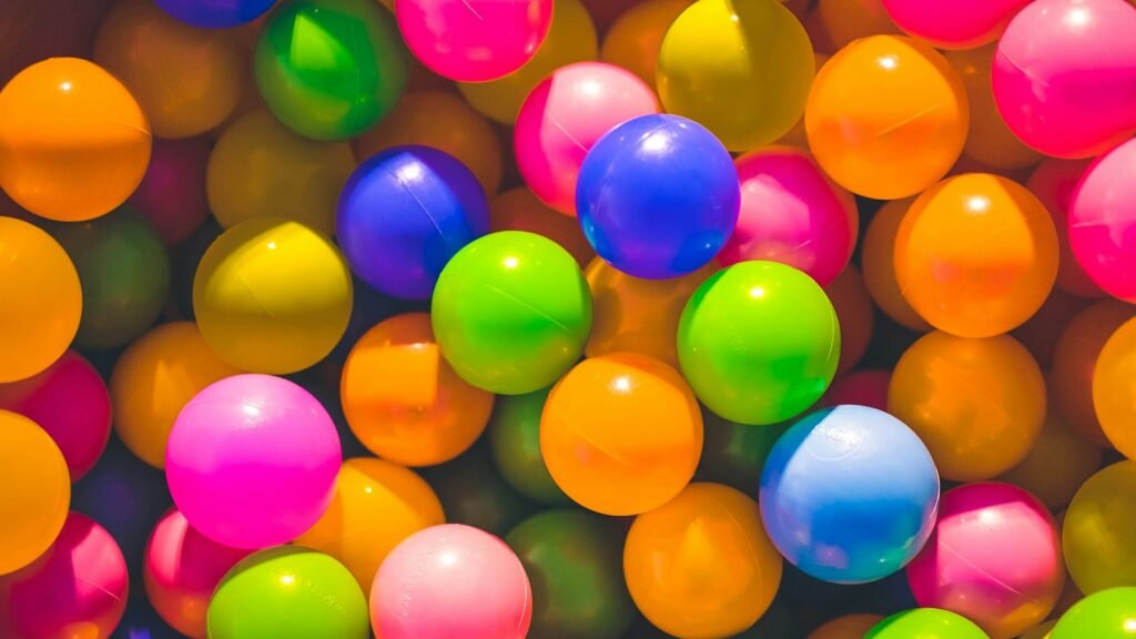 High angle photo of assorted-color plastic balls.
