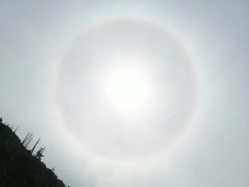 A person riding a surfboard in the ocean