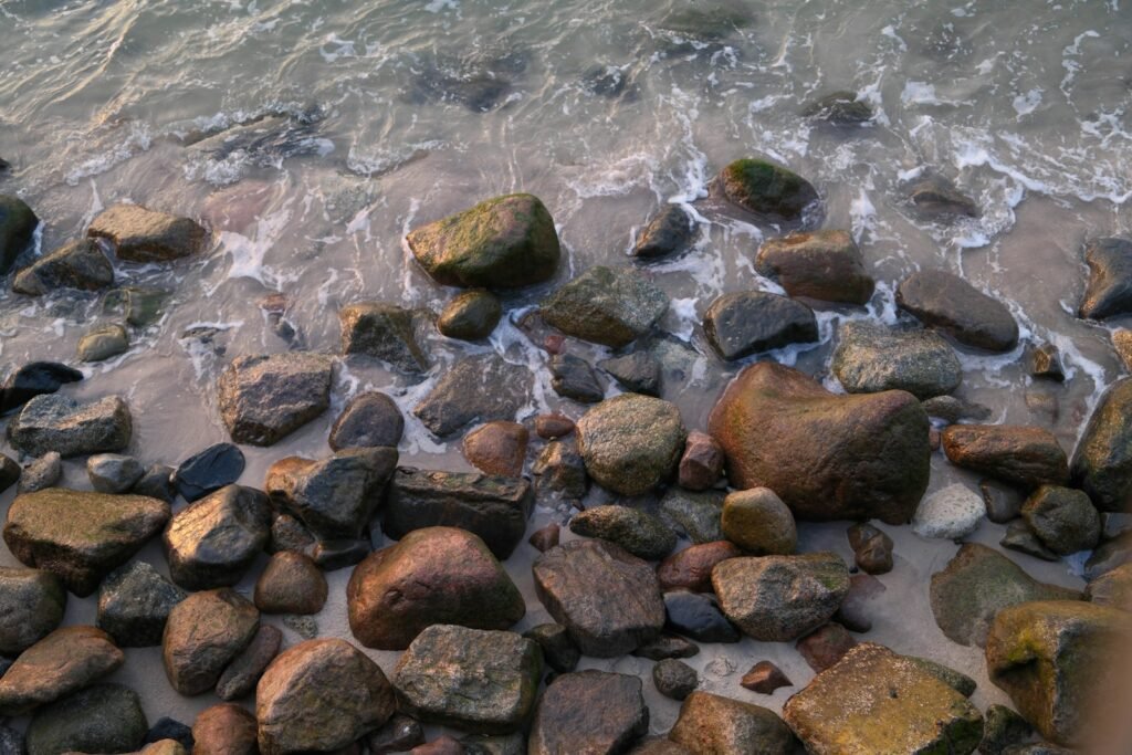 Waves crash on a rocky shoreline.