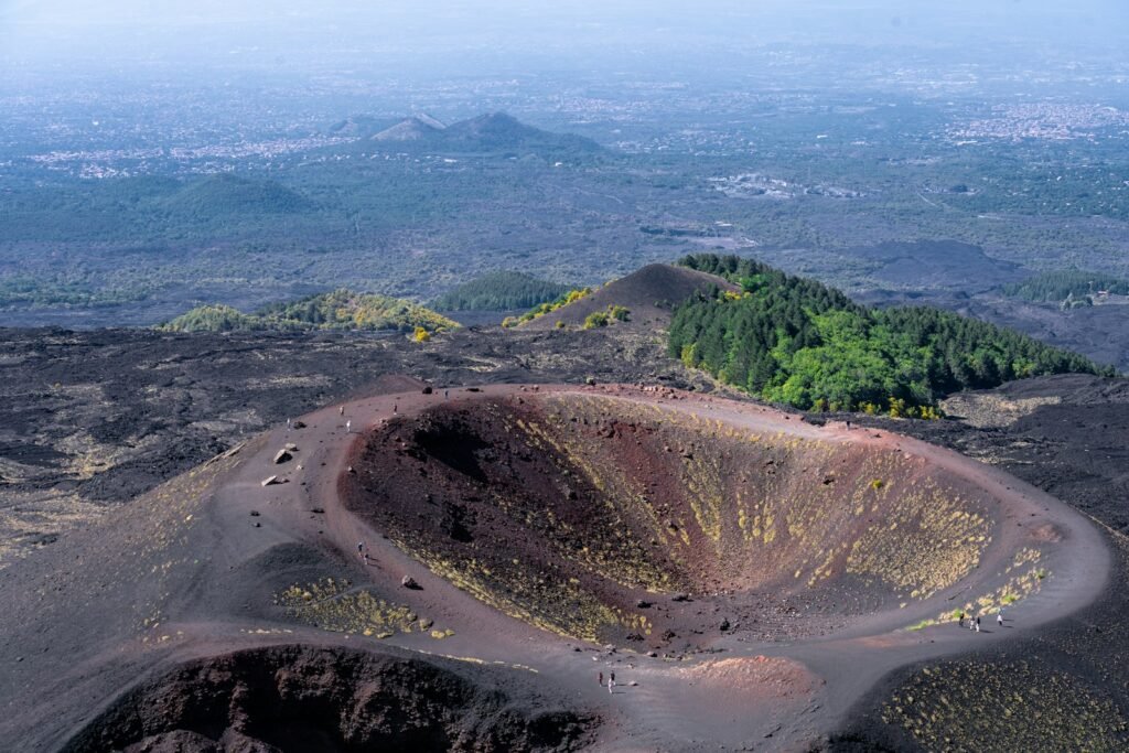An aerial view of a crater in the middle of a mountain