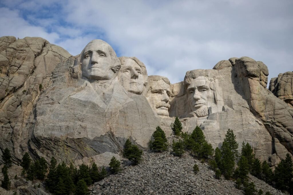 A breathtaking view of Mount Rushmore showcasing the iconic presidential sculpted faces in full daylight.