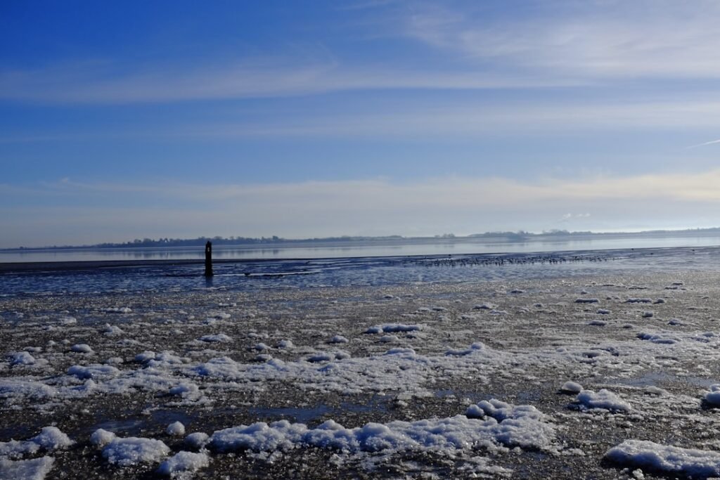 Beaches Covered in Perfect Ice Spheres - Freak Storm or Physics?