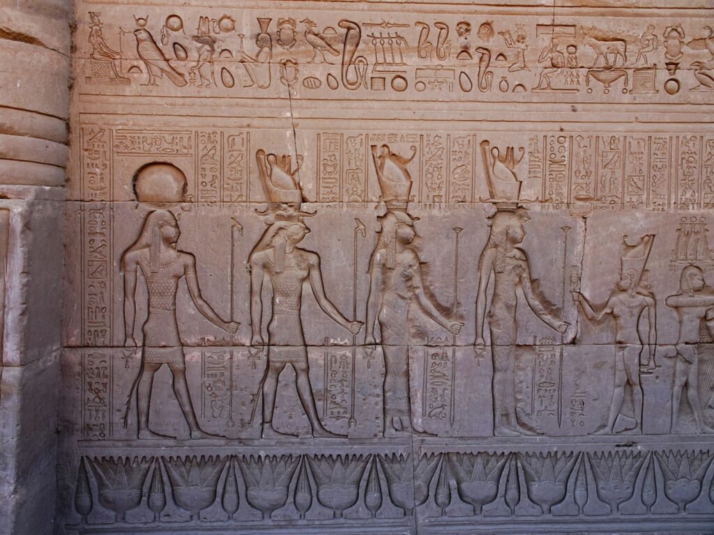 a stone wall with carvings