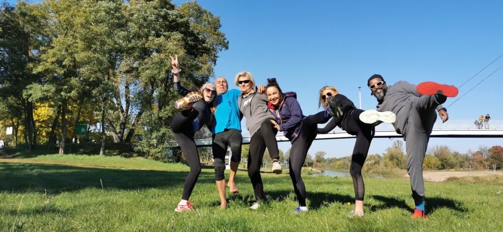 a group of people holding frisbees in their hands