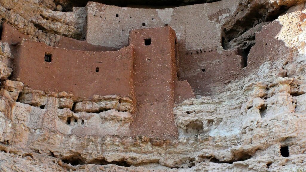 A cliff with a building built into the side of it