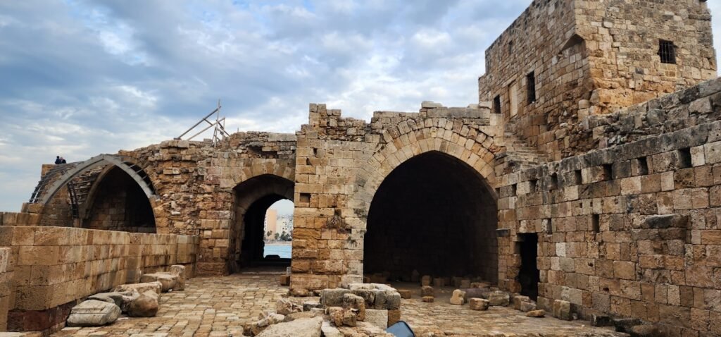 a large stone building with two arched doorways