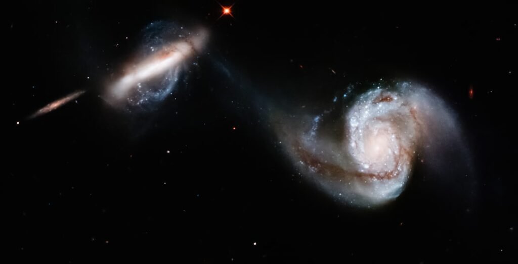 Astronomers find a third galaxy missing its dark matter, validating a violent cosmic collision theory