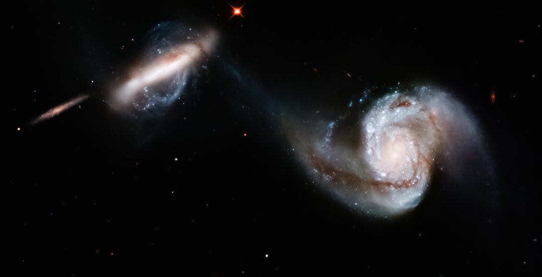 Astronomers find a third galaxy missing its dark matter, validating a violent cosmic collision theory