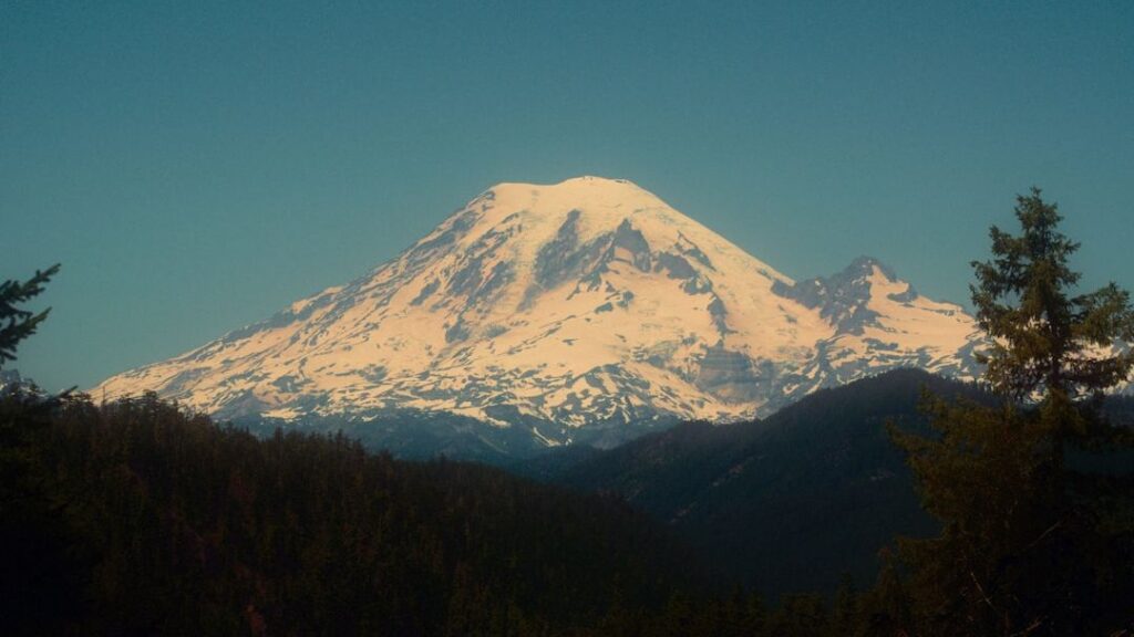 Mount Rainier's glaciers are retreating faster than expected increasing the risk of massive debris flows