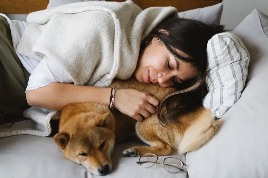 Psychology Says Dogs Who Sleep in Their Owner's Bed Show Measurably Lower Cortisol Levels Throughout the Night