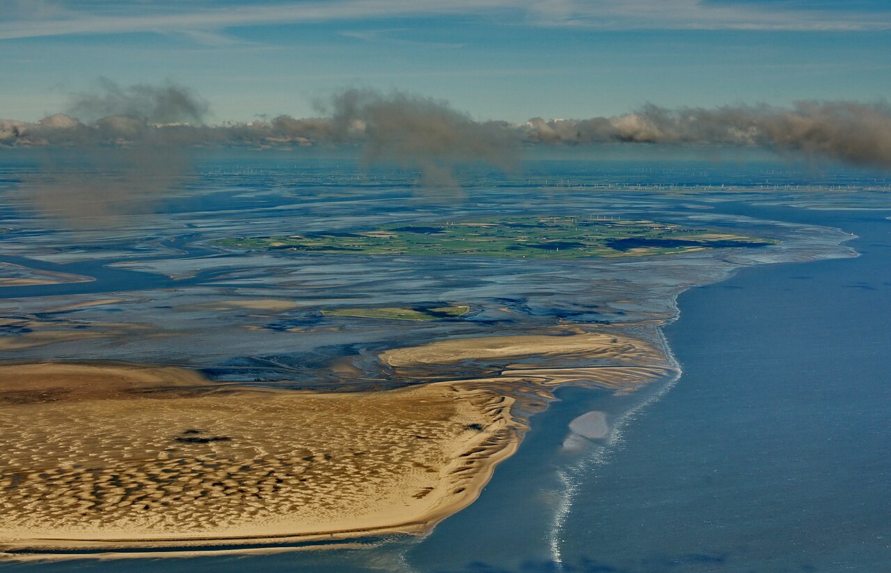 7. Wadden Sea, Netherlands–Germany–Denmark – Tides, Mudflats, and Migrant Clouds