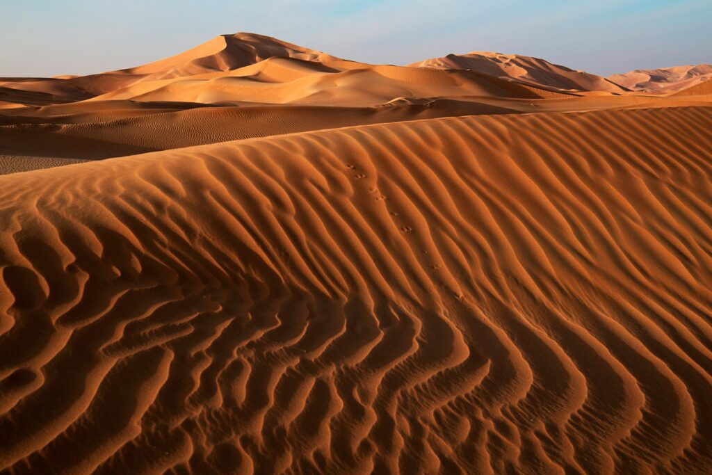 9 Places Where Sand Dunes Move Fast Enough to Bury Roads and Buildings